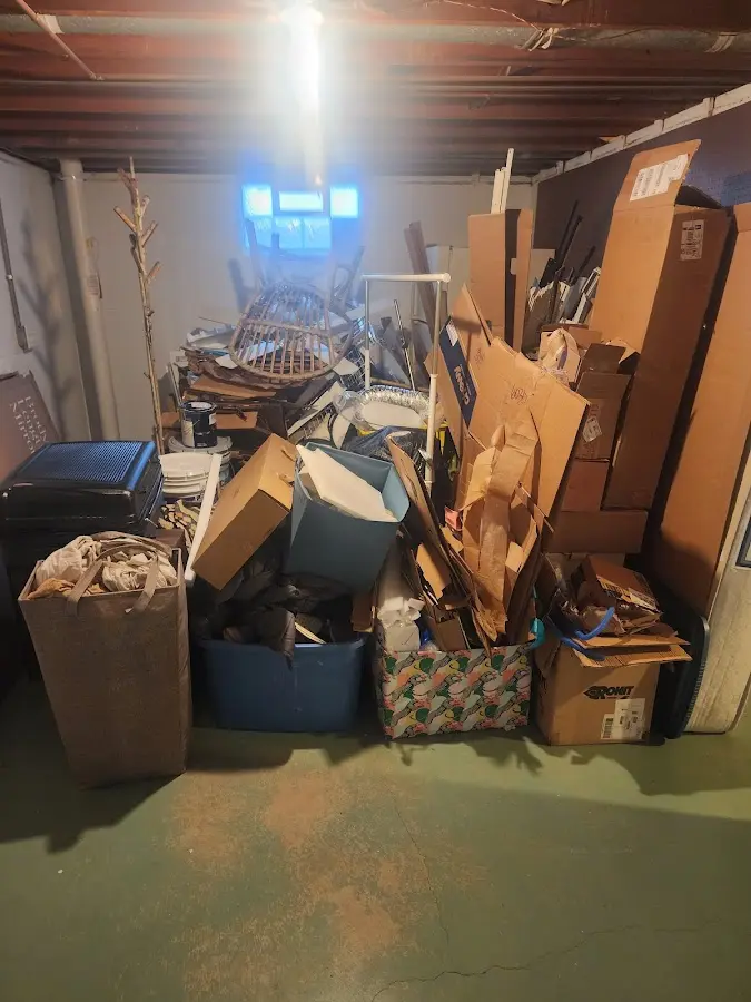 Roll-off dumpster container at job site for 2 Yard Dumpster Rental in Kinston